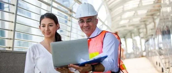 Stock photo - Woman and man with hardhat and laptop (Identifying key stakeholders for government transportation departments cover)